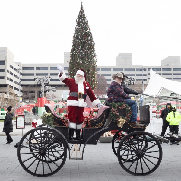 Santa on wagon waiving